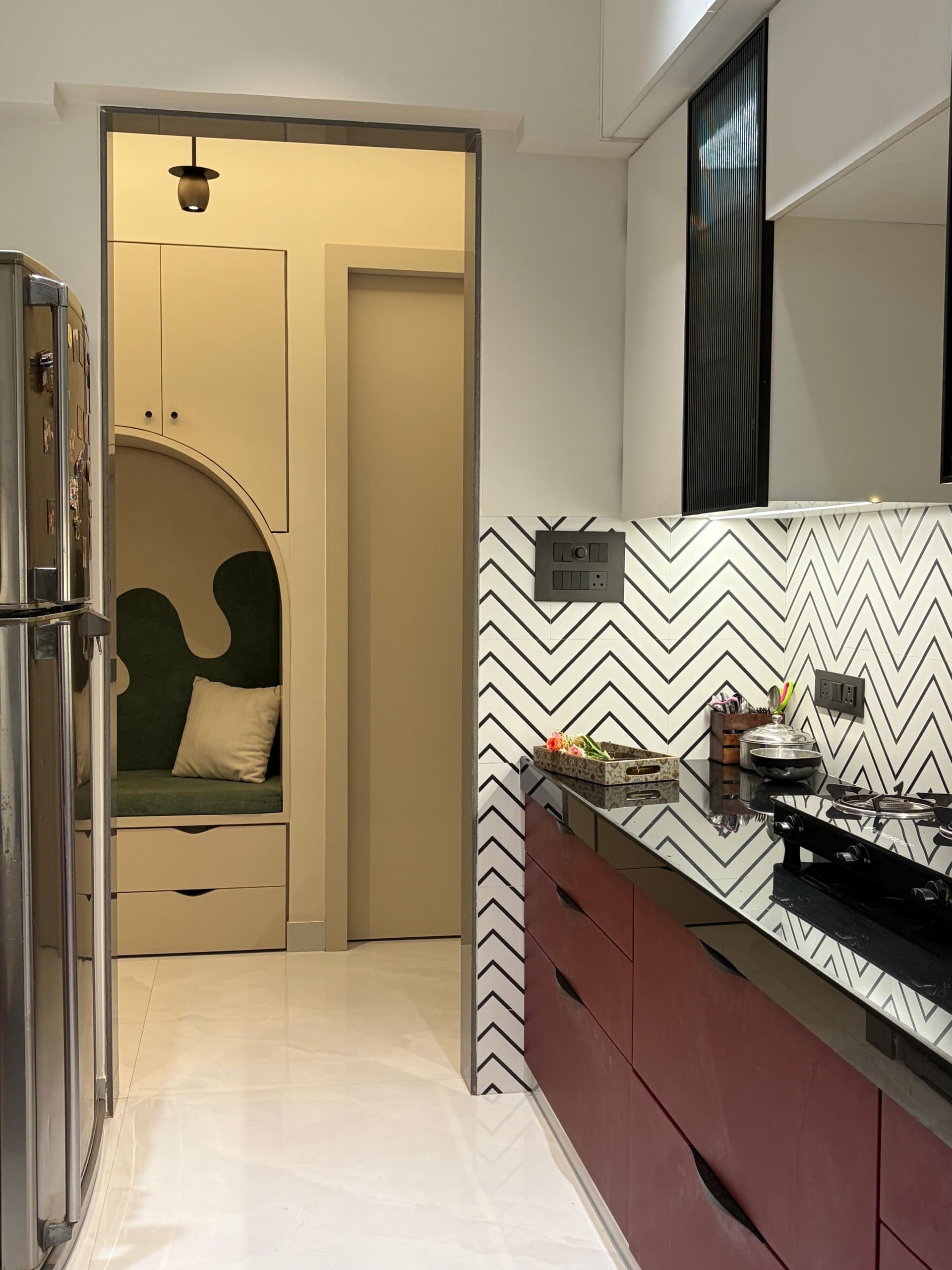 Kitchen galley in oxblood and chevron tile